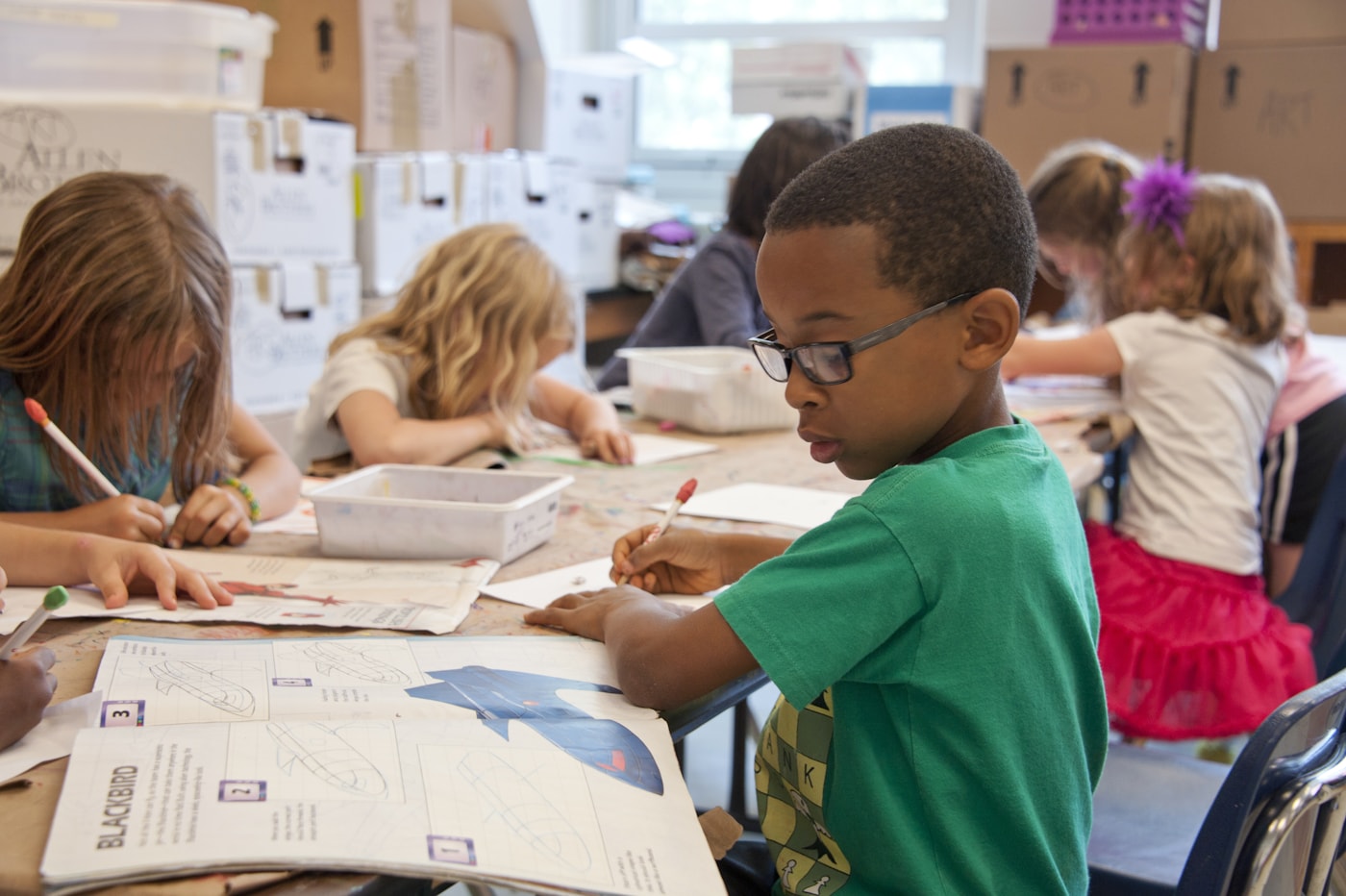 A child reading with support